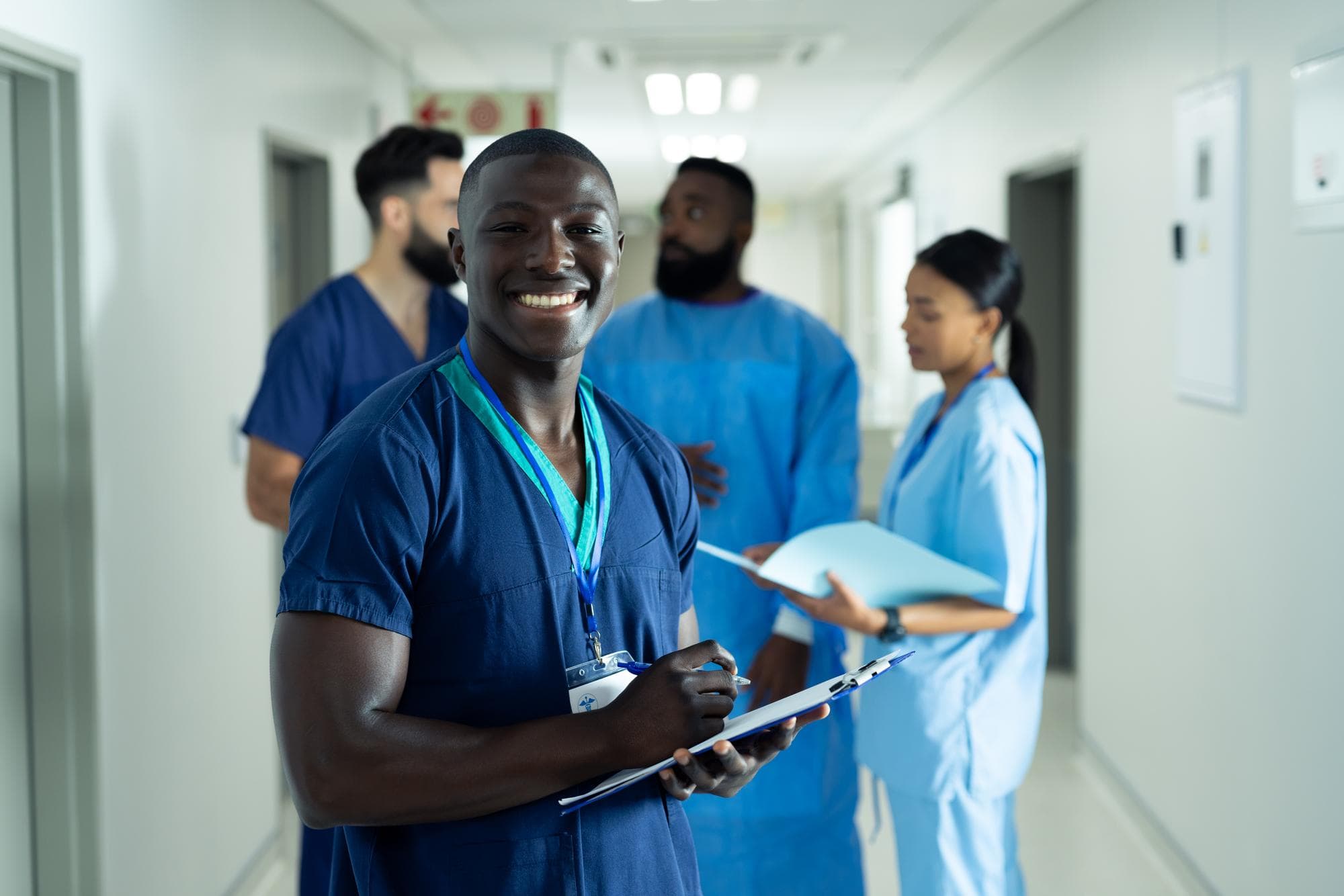 Healthcare workers on shift in a hospital corridor