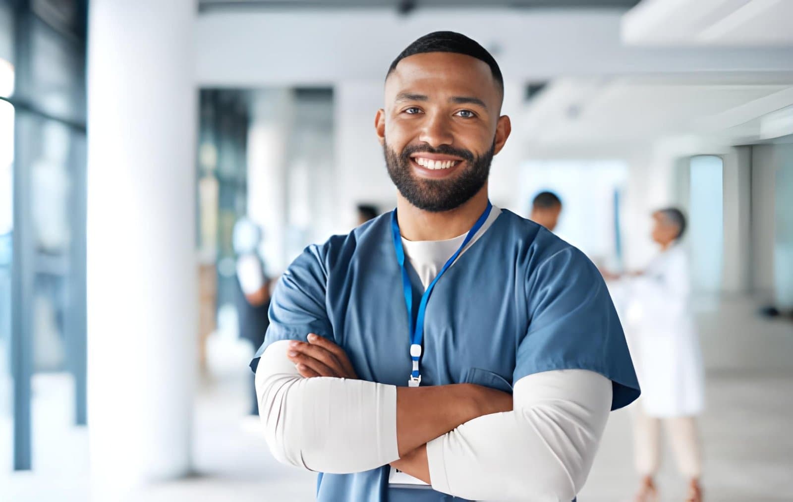 A smiling nurse in scrubs